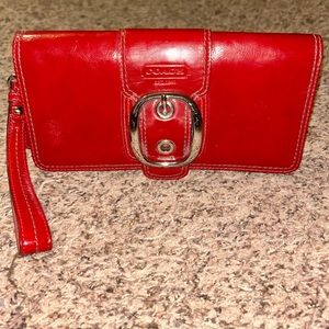 Like new! Coach Crimson Red Patent Leather Buckle Wristlet Wallet